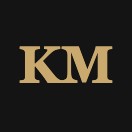 KM monogram logo in gold letters on black background