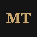 Gold letters MT on black background, company logo